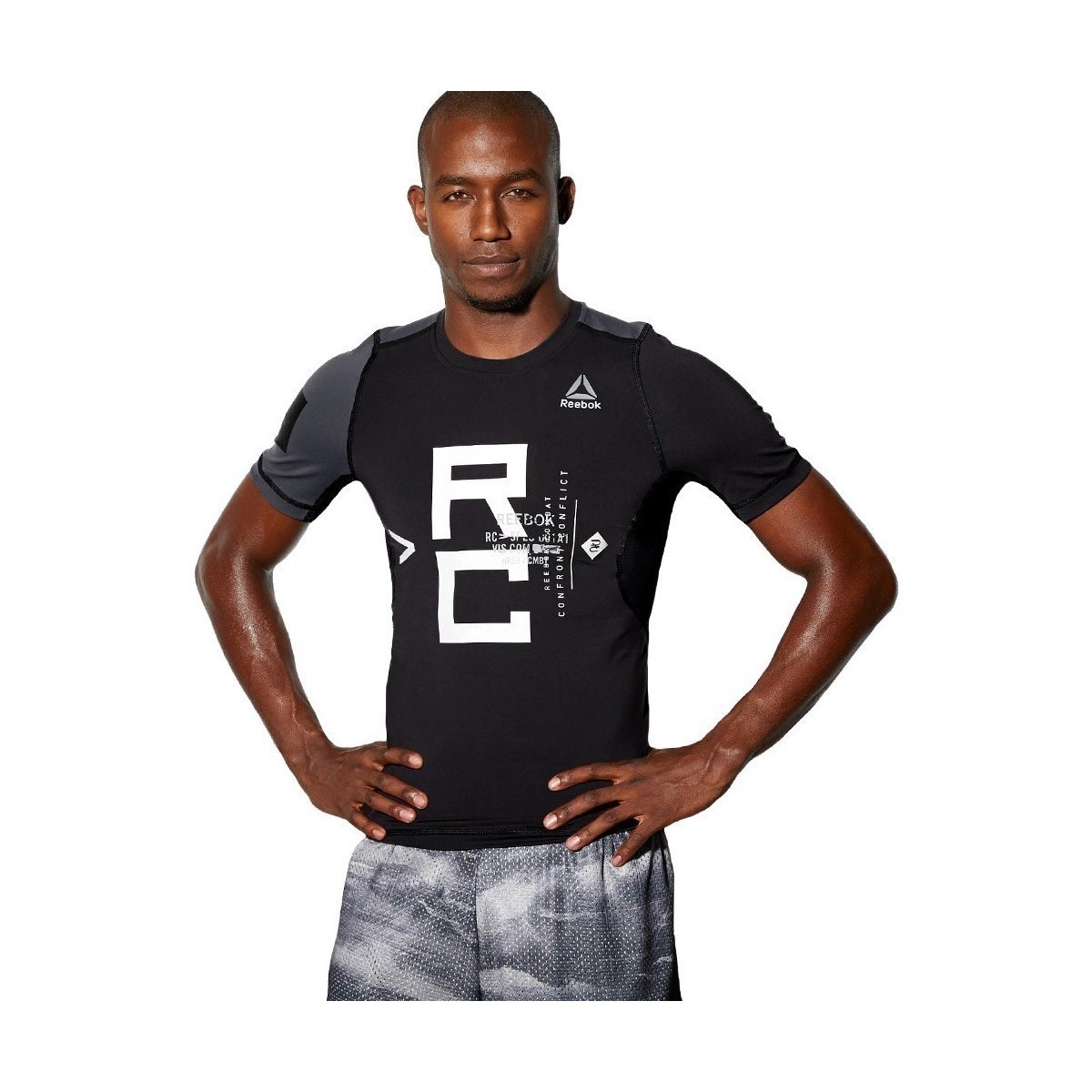 Vêtements Homme T-shirts manches courtes Reebok Sport Combat SS Rash Guard Noir, Gris