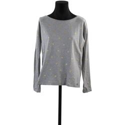Pullover shirt boasts a bateau neckline and long sleeves