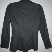 Pullover shirt boasts a boat neckline and long sleeves