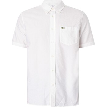 Vêtements Homme Chemises manches courtes Lacoste Chemise à manches courtes avec logo régulier Blanc